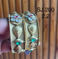 Kundan Two-Tone Leaf Medallion Bangle Set — original client product photograph