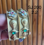 Kundan Two-Tone Leaf Medallion Bangle Set — original client product photograph