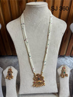Heritage White Bead Sculpted Drop Necklace Set — original client product photograph