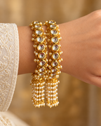 Kundan Round Stone Pearl Fringe Bangle Set — AI-styled wearing view; illustrative scale, compare original photograph