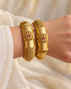 Kundan Central Floral Cuff Bangle Set — AI-styled wearing view; illustrative scale, compare original photograph
