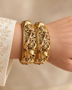 Kundan Peacock Vine Red Accent Bangle Set — AI-styled wearing view; illustrative scale, compare original photograph